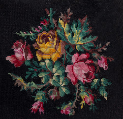 Cross-stitch the bouquet of roses and leafs on black background.