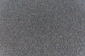 Closeup of Black Sand on a Volcanic Beach in Sicily for Backgrounds