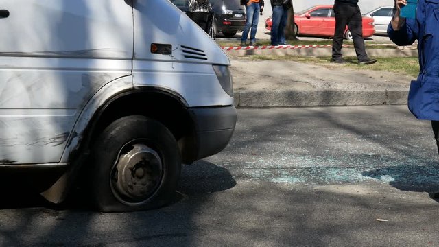 Broken minibus at avenue after road accident