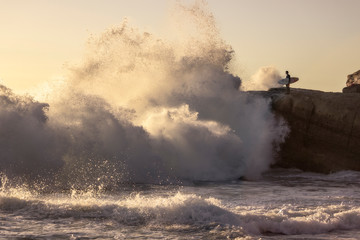 A Surfer Checks Out The High Surf In California