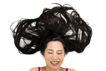 Fototapeta premium Closeup portrait of happy asian women lying on ground with black long hair. acting smile, fun,