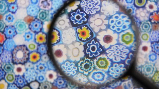 Murrine colored patterns concept view through magnifying glass
