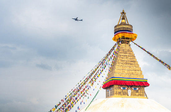 NEPAL, BOUDHANATH STUPA - AUGUST 19, 2014: top of boudhanath stupa temple with color flags decorating