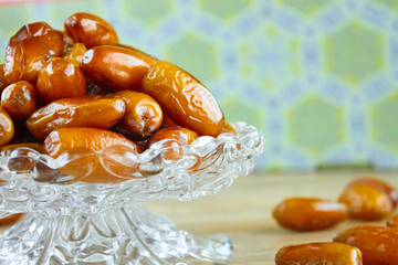 sweet algerian arabic dates fruits on a glass plate