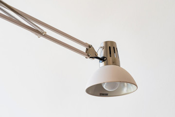 Close up modern office lamp on white blurred background