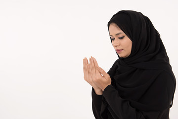 Muslim woman praying on white Background