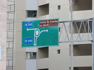 Traffic plate with building under renovation in the background