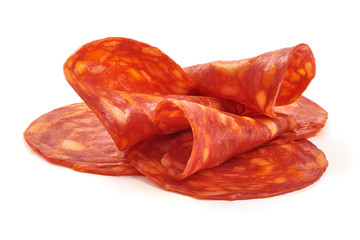 Sliced tasty chorizo sausage, close-up, isolated on white background