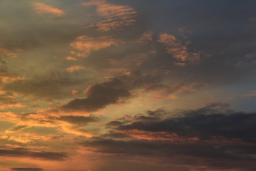 Vivid dramatic twilight sunset sky with colorful clouds and silhouettes of birds