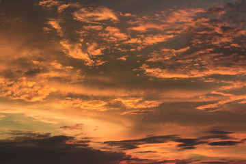 Vivid dramatic twilight sunset sky with colorful clouds and silhouettes of birds