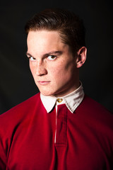 Fototapeta premium Redheaded man in red shirt with white collar