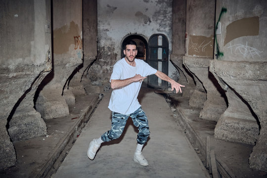 Male dancing in old building