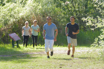 athletic people jogging in nature