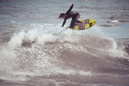 Man on surf board on water wave
