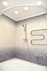 Bathroom fragment with finishing by a mosaic tile