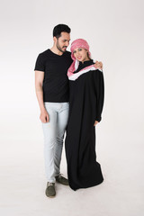 Arab couple standing and posing on white background