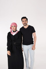 Arab couple standing and posing on white background