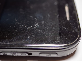 Broken screen phone on white table