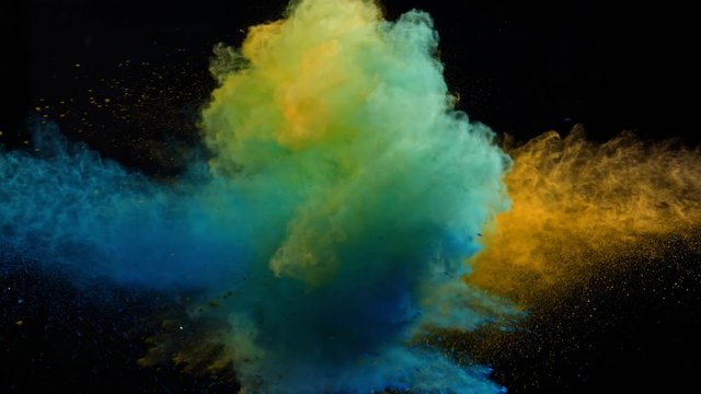 Super Slowmotion Shot of Color Powder Explosion Isolated on Black Background.