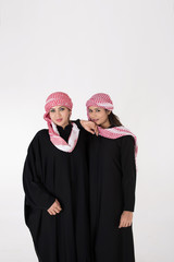 Young Arab Females in traditional dress on white background