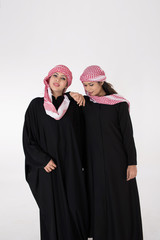Young Arab Females in traditional dress on white background