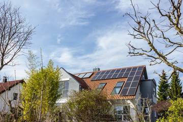 house with solar panels on rooftop