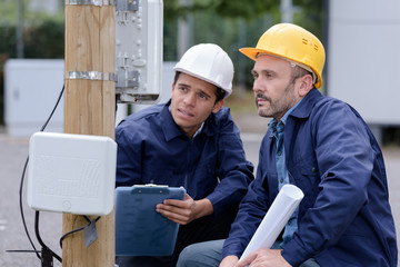technician with client showing what is being fixed
