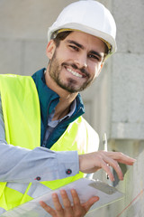 happy builder on construction site
