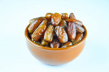 sweet algerian arabic dates fruits on an orange plate