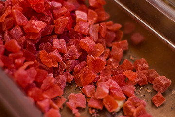 canned red pineapple peaces supermarket counter by weight