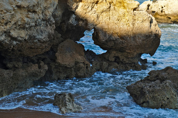 Idyllic sea, rocks and cliffs scenery in Aveiros Beach. Albufeira, Algarve, Portugal