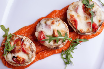Stuffed mushrooms with parmesan crust and fresh herbs.