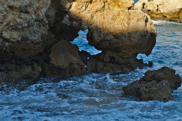 Idyllic sea, rocks and cliffs scenery in Aveiros Beach. Albufeira, Algarve, Portugal