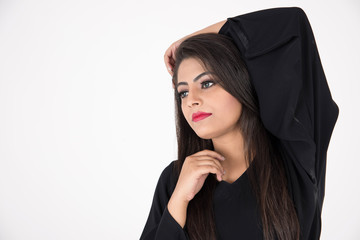 Arab woman in traditional dress on white background