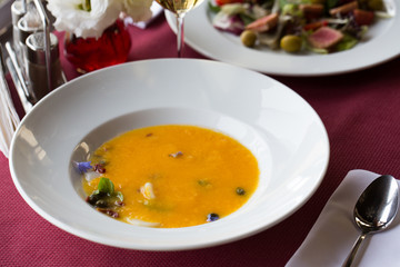 pumpkin cream soup. Dinner in restaurant