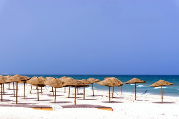 Empty Beach Covered with Umbrellas in Sousse, Tunisia.