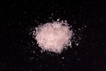 salt close up. salt on a black background.