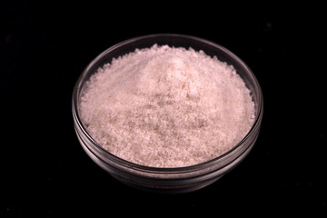 salt close up. salt on a black background.