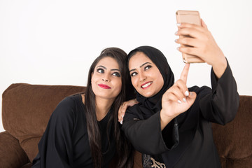 Arab Females sitting at home enjoying the time