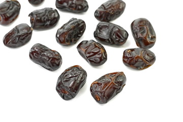 Dried dates over white background. Heap of dried dates isolated on white background.