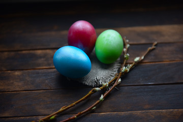 painted Easter eggs on wooden background