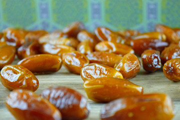 Sweet arabic algerian dates fruits on a wooden floor