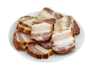 Smoked bacon slices on a plate isolated on white background.