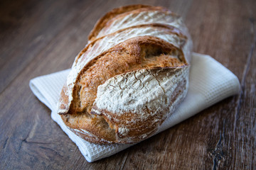 Homemade healthy freshly baked organic whole grain unleavened bread on wooden table