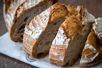 Homemade healthy freshly baked organic whole grain unleavened bread on wooden table