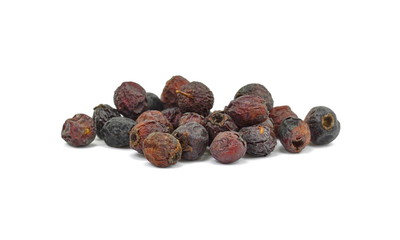 Dried medicinal herbs raw materials isolated on white. Fruit of Crataegus commonly called hawthorn, thornapple, May-tree, whitethorn, or hawberry. Cure for the heart. medicine in a cup of tea.