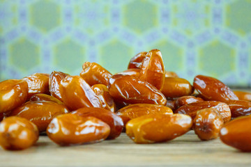 Sweet arabic algerian dates fruits on a wooden floor