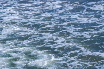 Texture of Black Sea. Blue frothy surface of sea water. Background shot of aqua sea water surface aerial view.