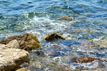 Texture of water. Abstract image of top view of shiny wave of clear sea water over sand beach, for beautiful background decoration of summer time. Game of light on the sea, sand beach . sea urchins.