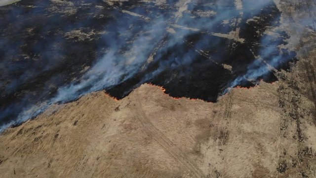 Above burning field, early autemn, tilt technique